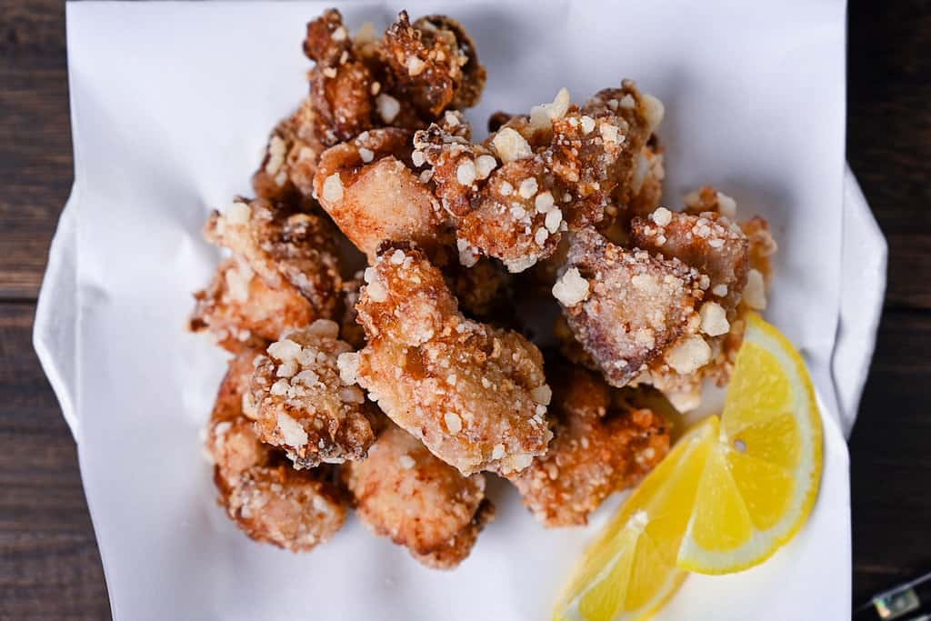 Authentic Japanese chicken karaage served with a slice of lemon