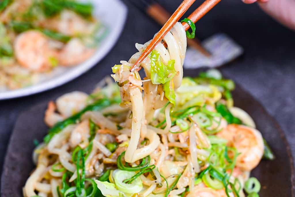 Shrimp yaki udon with salt and lemon sauce with chopsticks