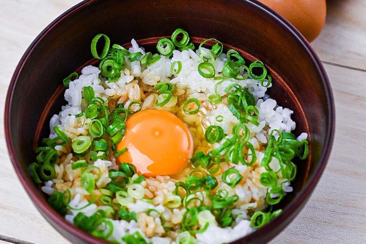 Tamago Kake Gohan topped with spring onions