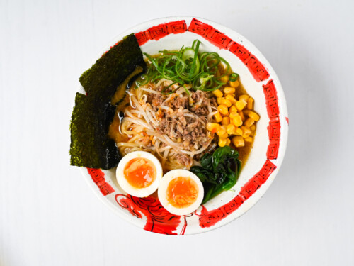 completed miso ramen in a bowl with nori and egg
