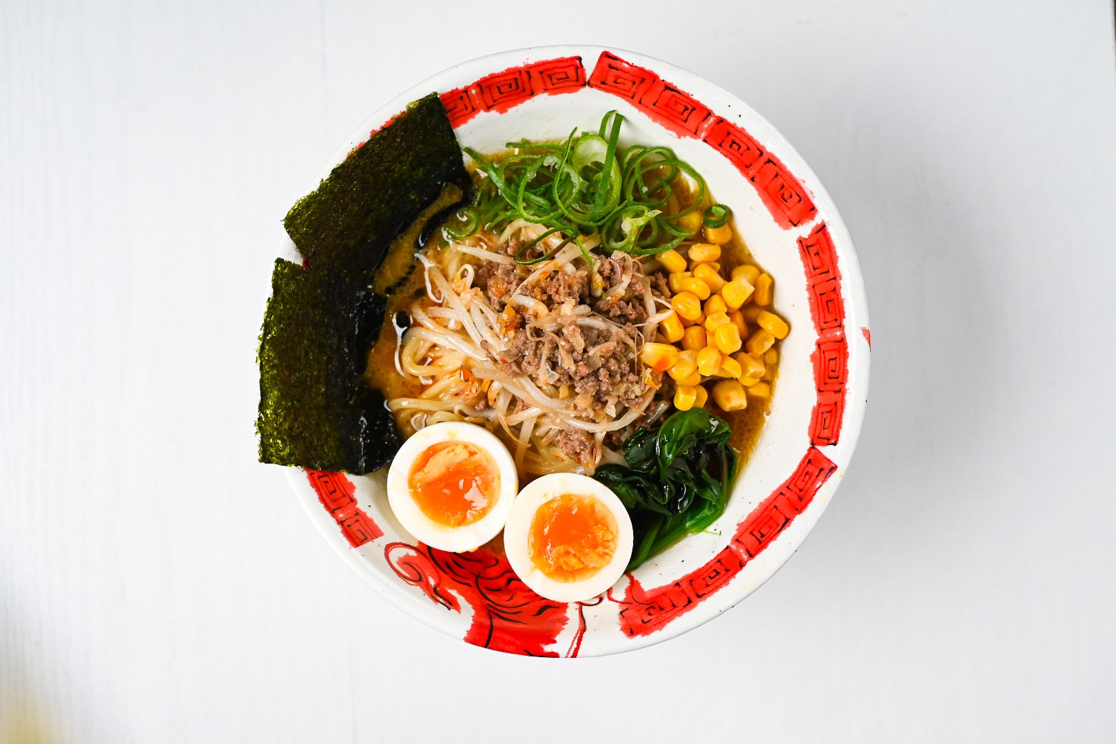 completed miso ramen in a bowl with nori and egg