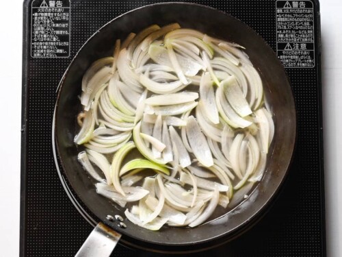 Simmering onions in broth for oyakodon