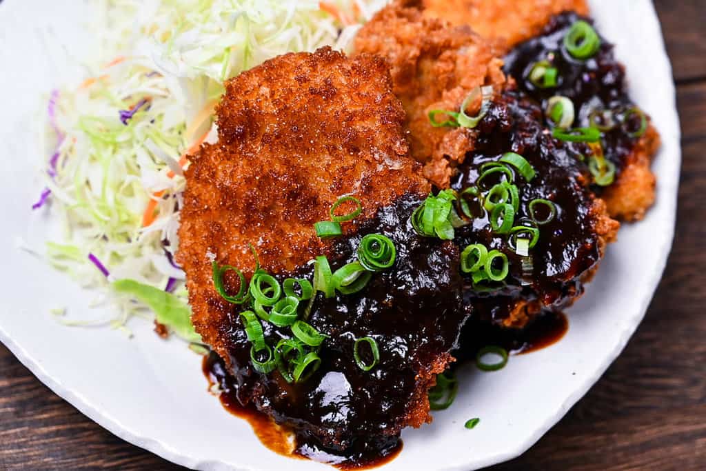 Hire katsu (breaded pork medallions) with Nagoya red miso sauce, shredded cabbage