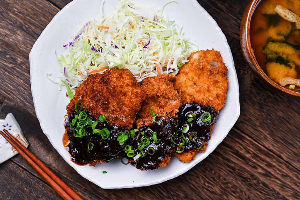 Hire katsu (breaded pork medallions) with Nagoya red miso sauce, shredded cabbage and miso soup