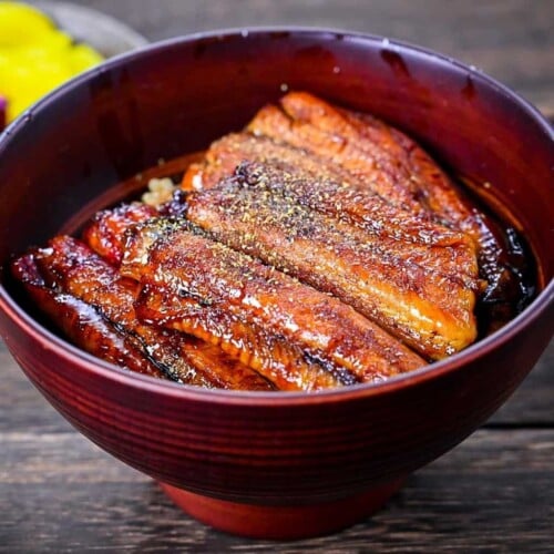 Unagi don (Japanese Grilled Eel Rice Bowl) sprinkled with sansho Japanese pepper featured