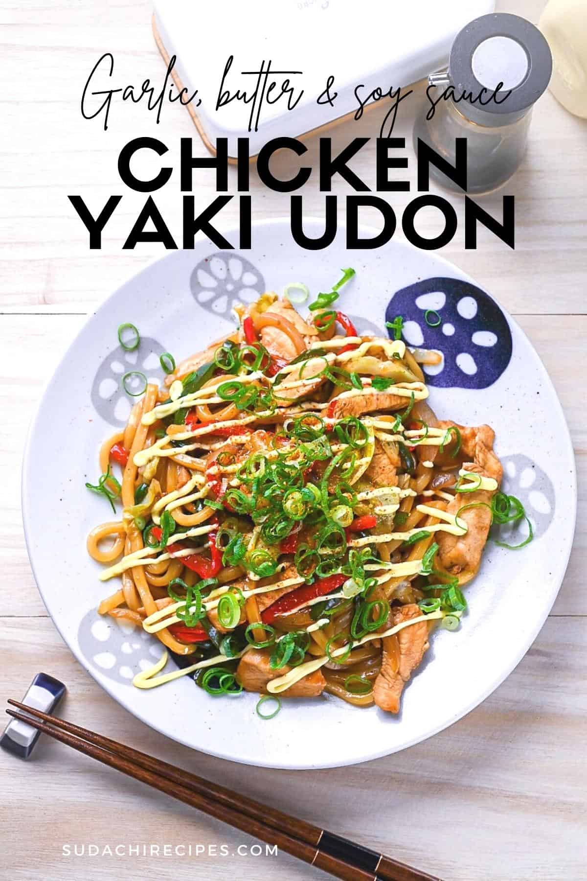 Chicken yaki udon served on a white plate, drizzled with Japanese mayo and topped with spring onions