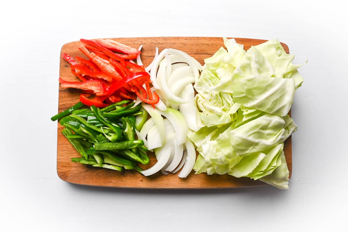 Yaki udon ingredients on a wooden chopping board