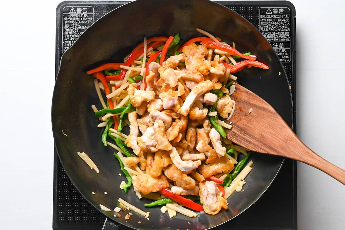 adding pork back to wok for chinjao rosu