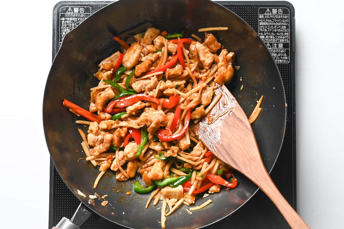 adding chinajo rosu sauce to wok