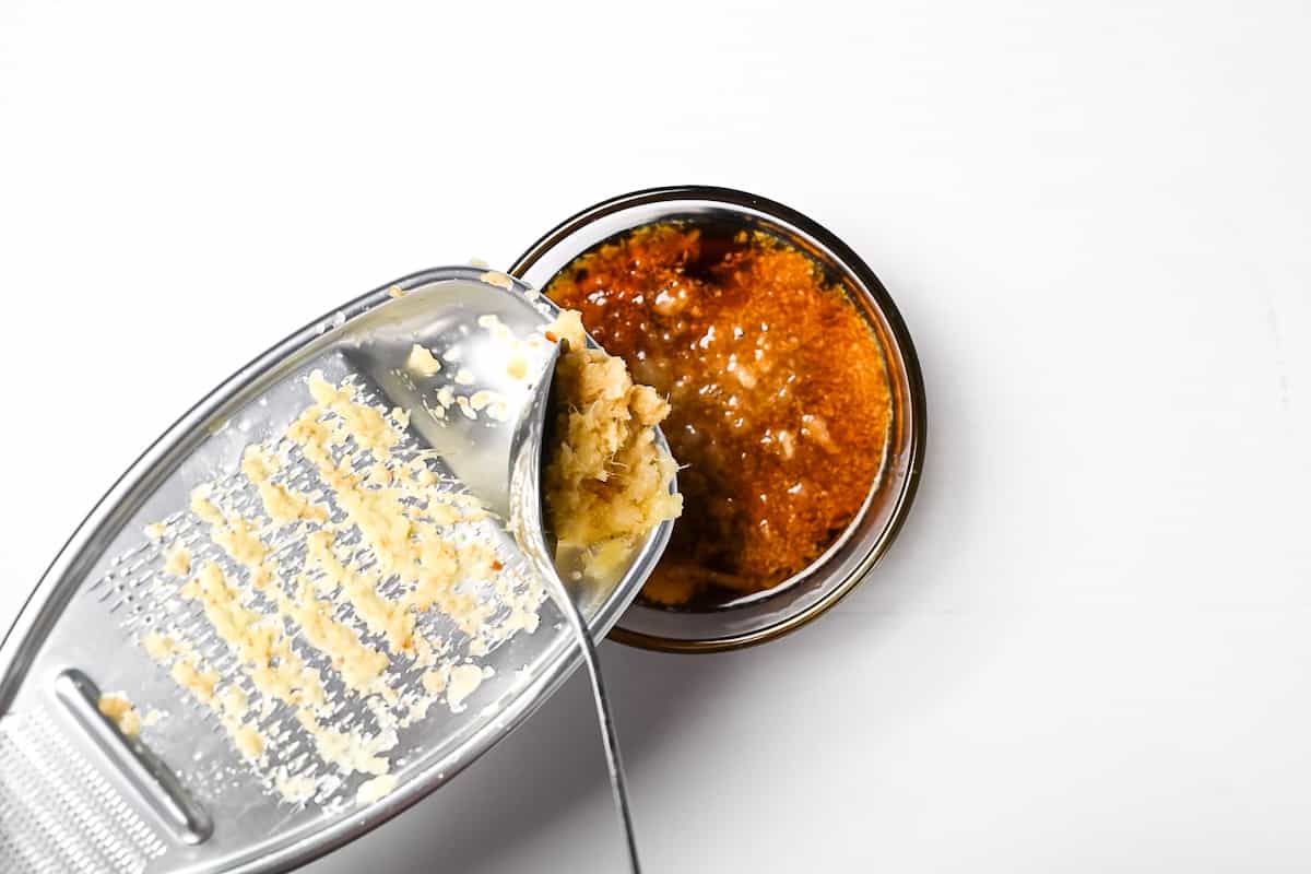 mixing grated ingredients with condiments for shogayaki sauce