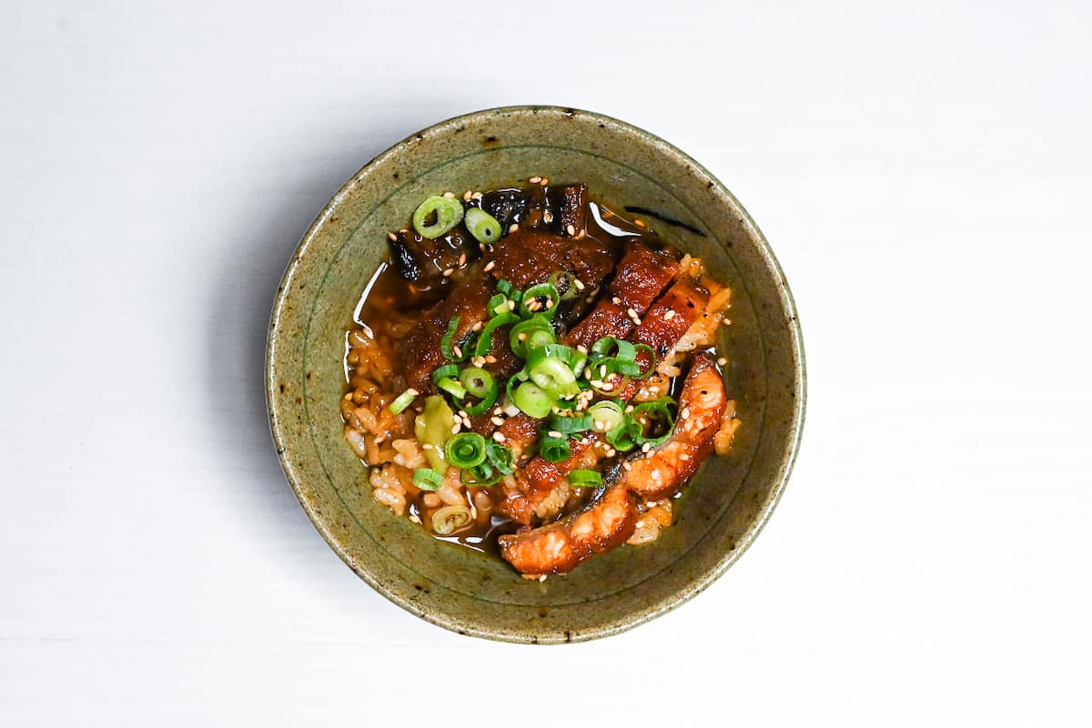 Hitsumabushi in a green rice bowl steeped in dashi/green tea broth as "unagi chazuke"