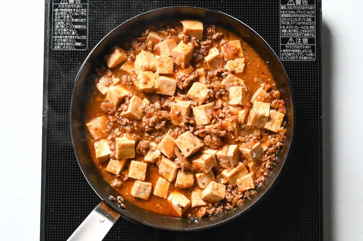 Add slurry to thicken mapo tofu