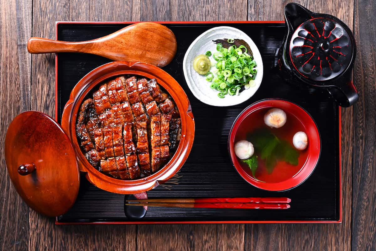 Unagi Hitsumabushi Nagoya Style Grilled Eel served on a black lacquerware tray