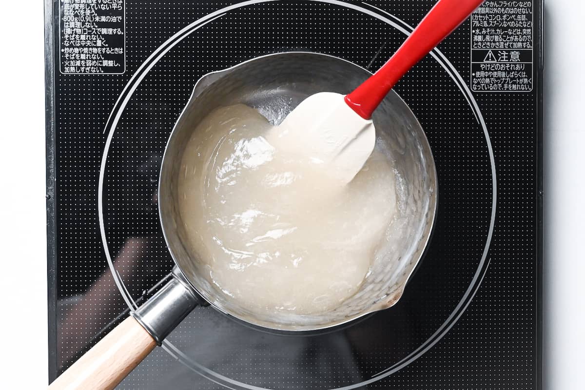 cooked warabi mochi in a silver saucepan