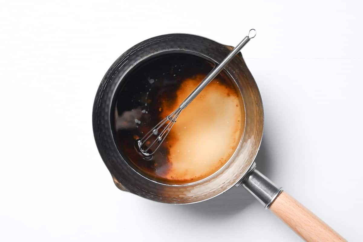 caster sugar and muscovado sugar in a saucepan