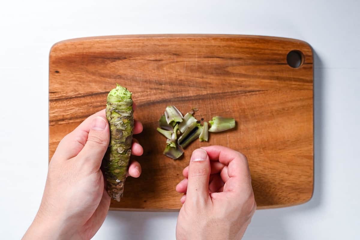 Removing the stems of wasabi root