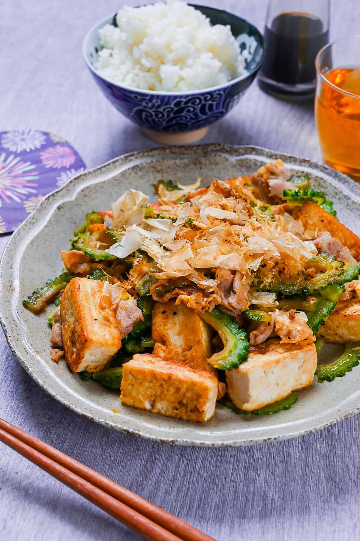 Goya Champuru (Okinawan Bitter Melon Stir Fry) on a grey plate with rice