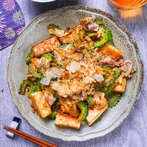 Goya Champuru (Okinawan Bitter Melon Stir Fry) on a grey plate top down view