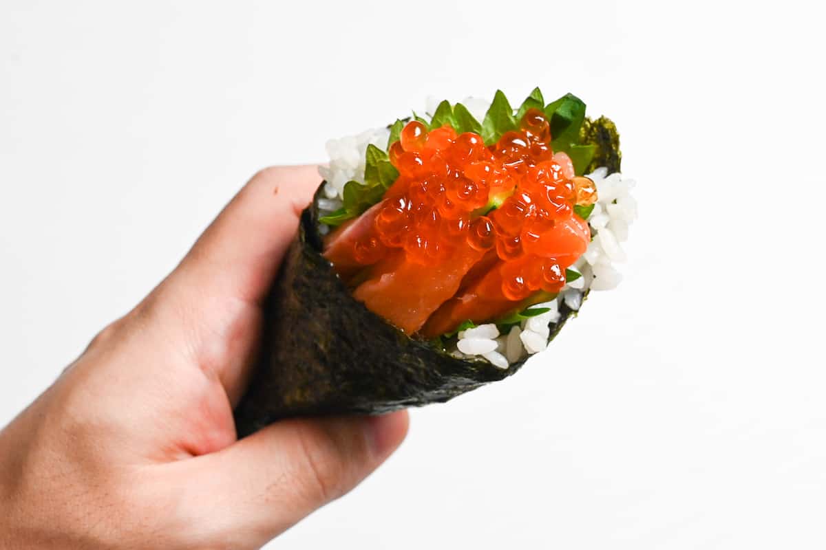 Salmon and ikura temaki sushi hand roll