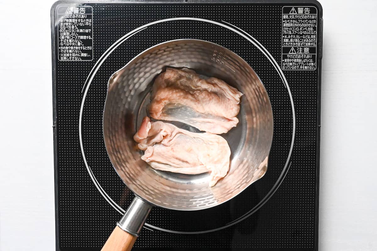chicken skin in a pan