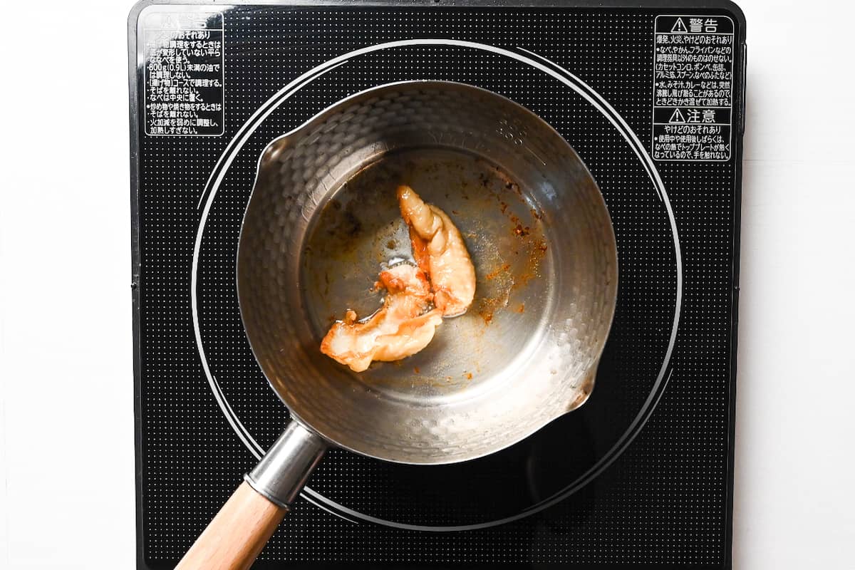 crispy cooked chicken skin in a pan