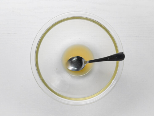 sake, mirin, sugar and salt mixed in a glass mixing bowl