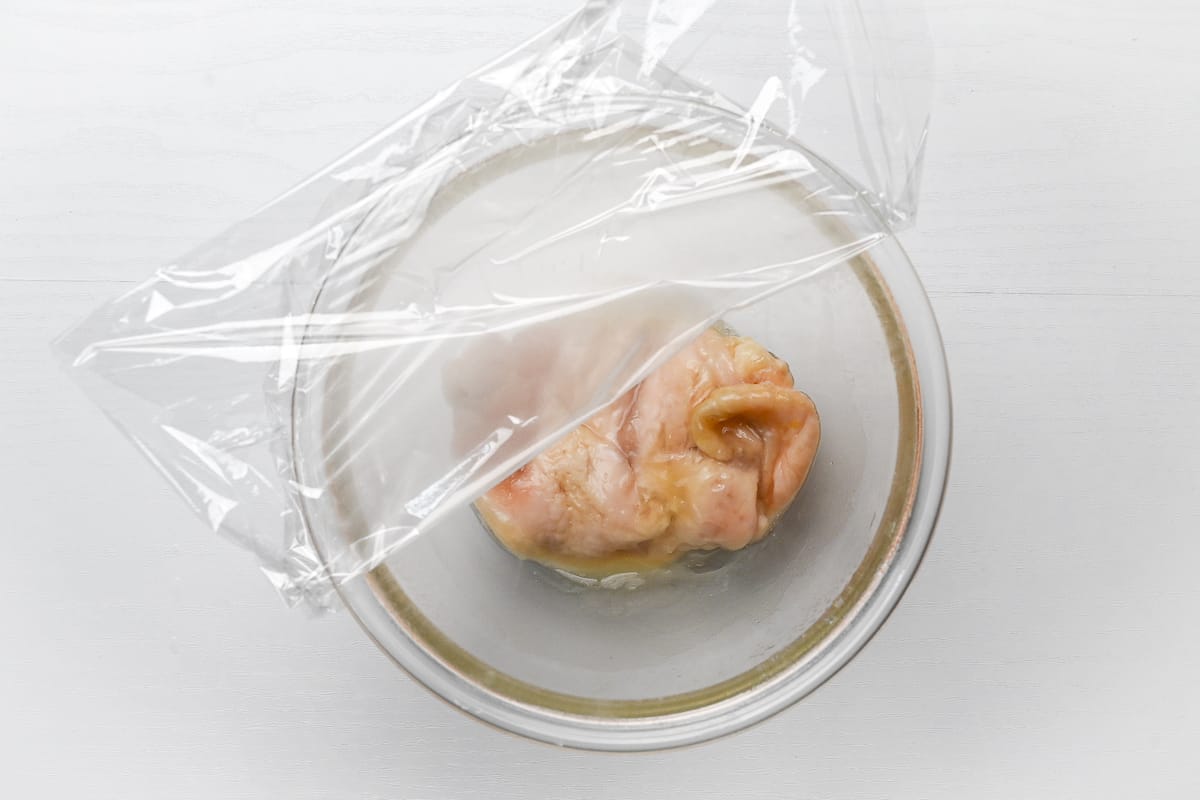 chicken breast microwaved in a glass bowl