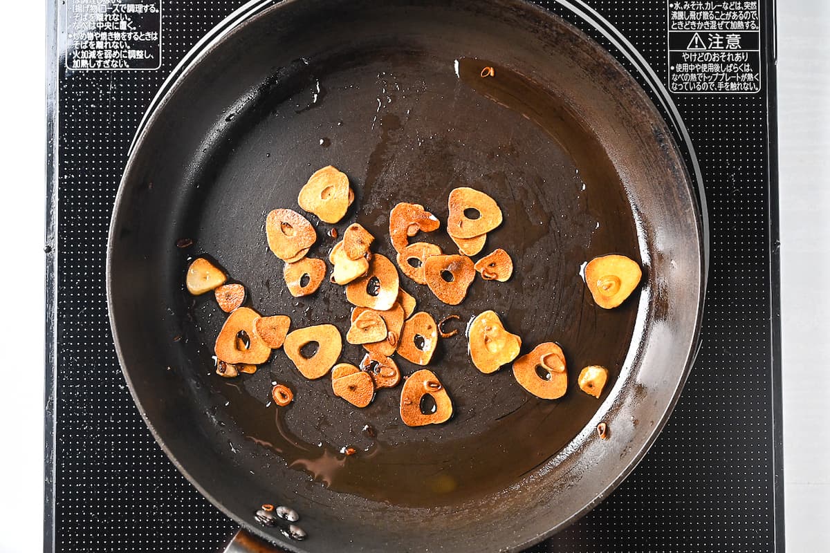 crispy garlic chips fried in a frying pan