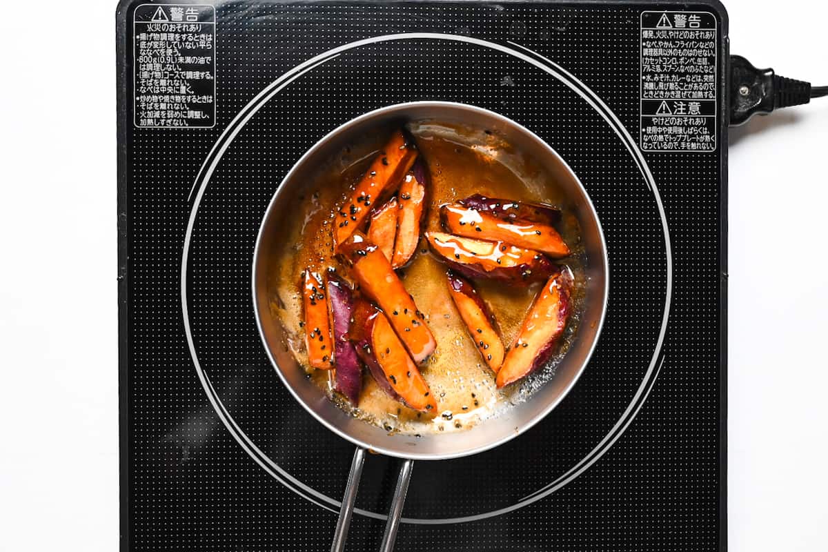 Adding soy sauce, black sesame seeds and sweet potato to caramel