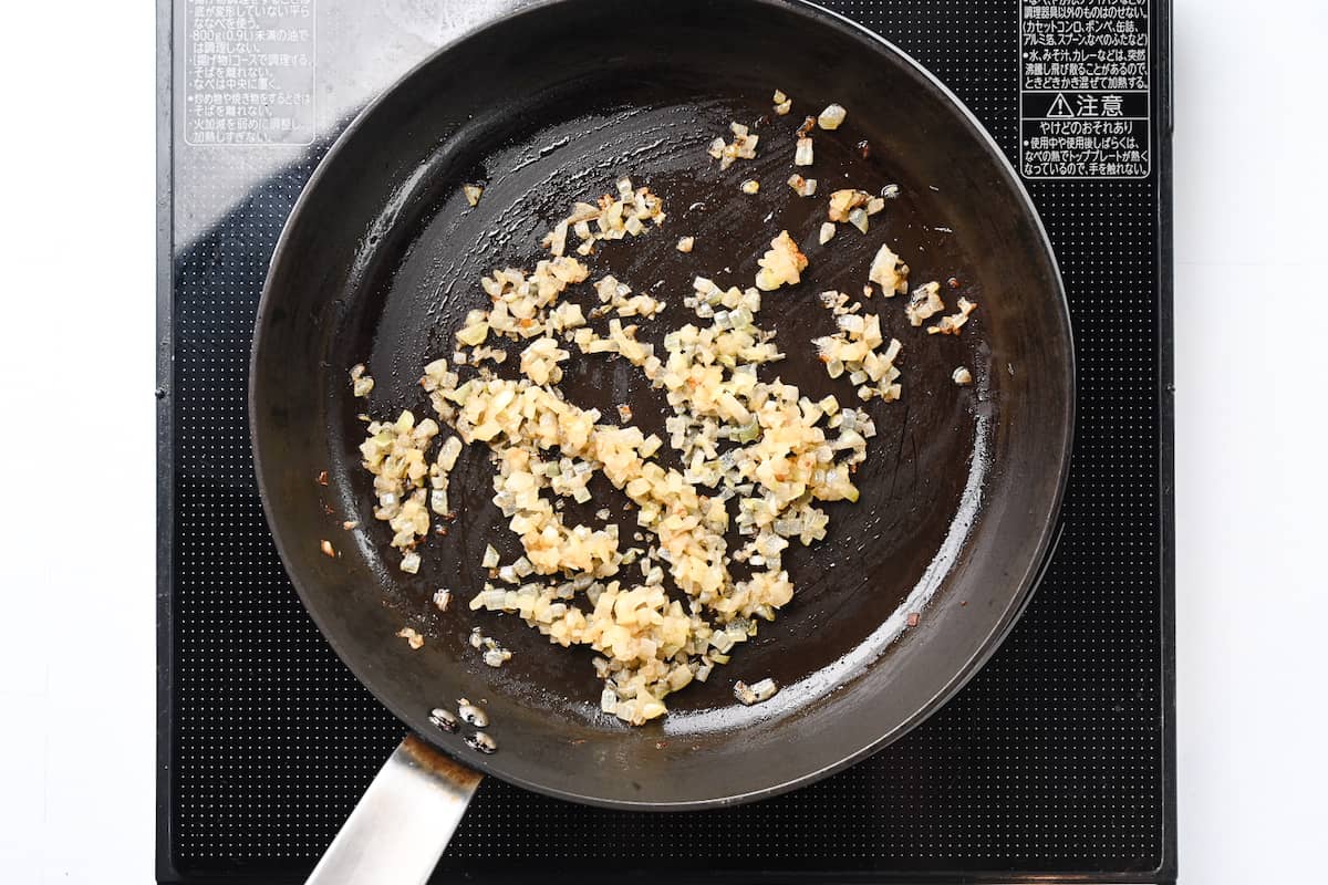 frying onions in a pan