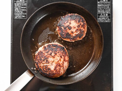 hamburg patties flipped in a pan