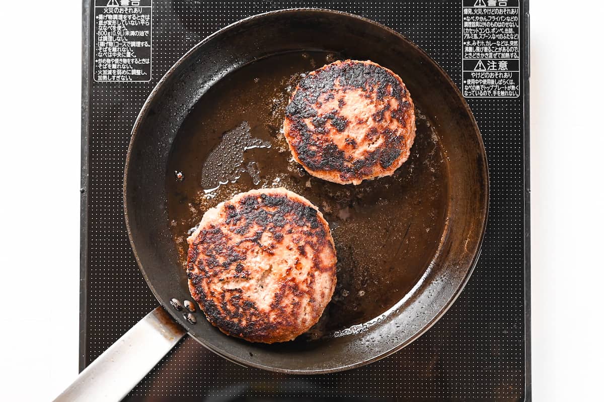 hamburg patties flipped in a pan