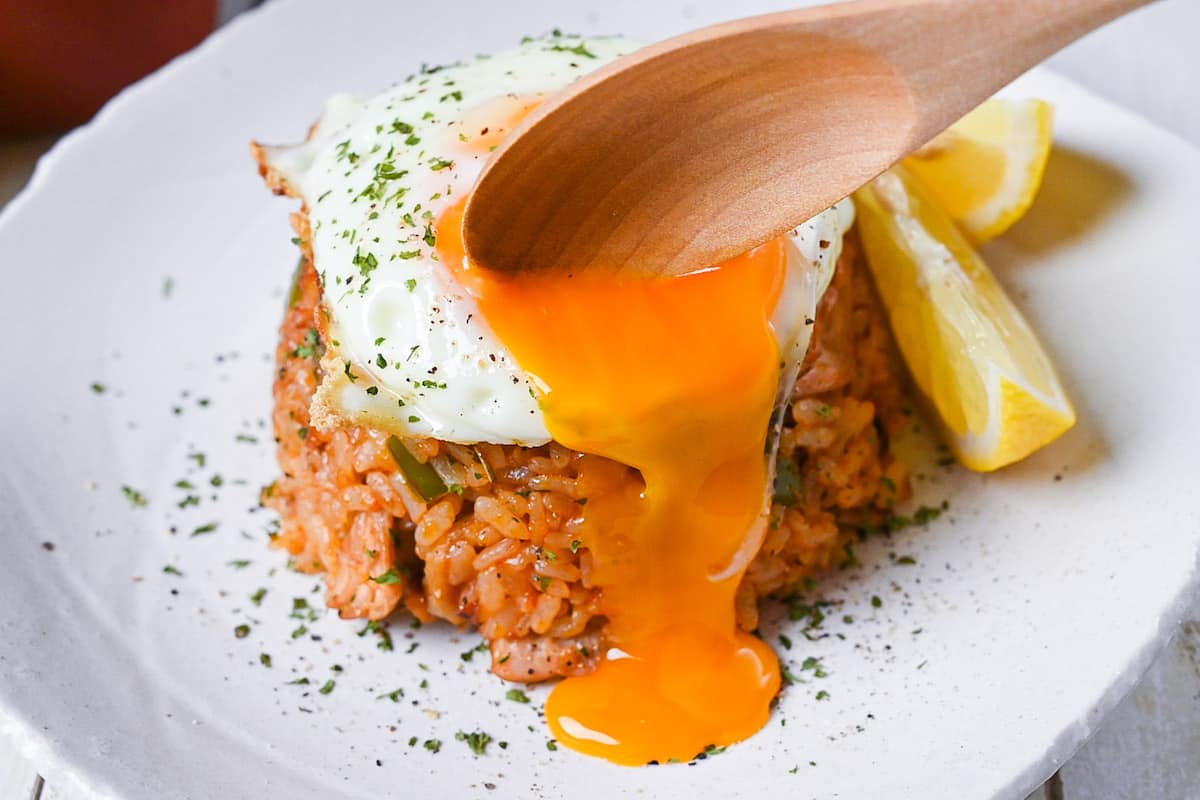Japanese ketchup rice (chicken rice) topped with egg with a runny yolk