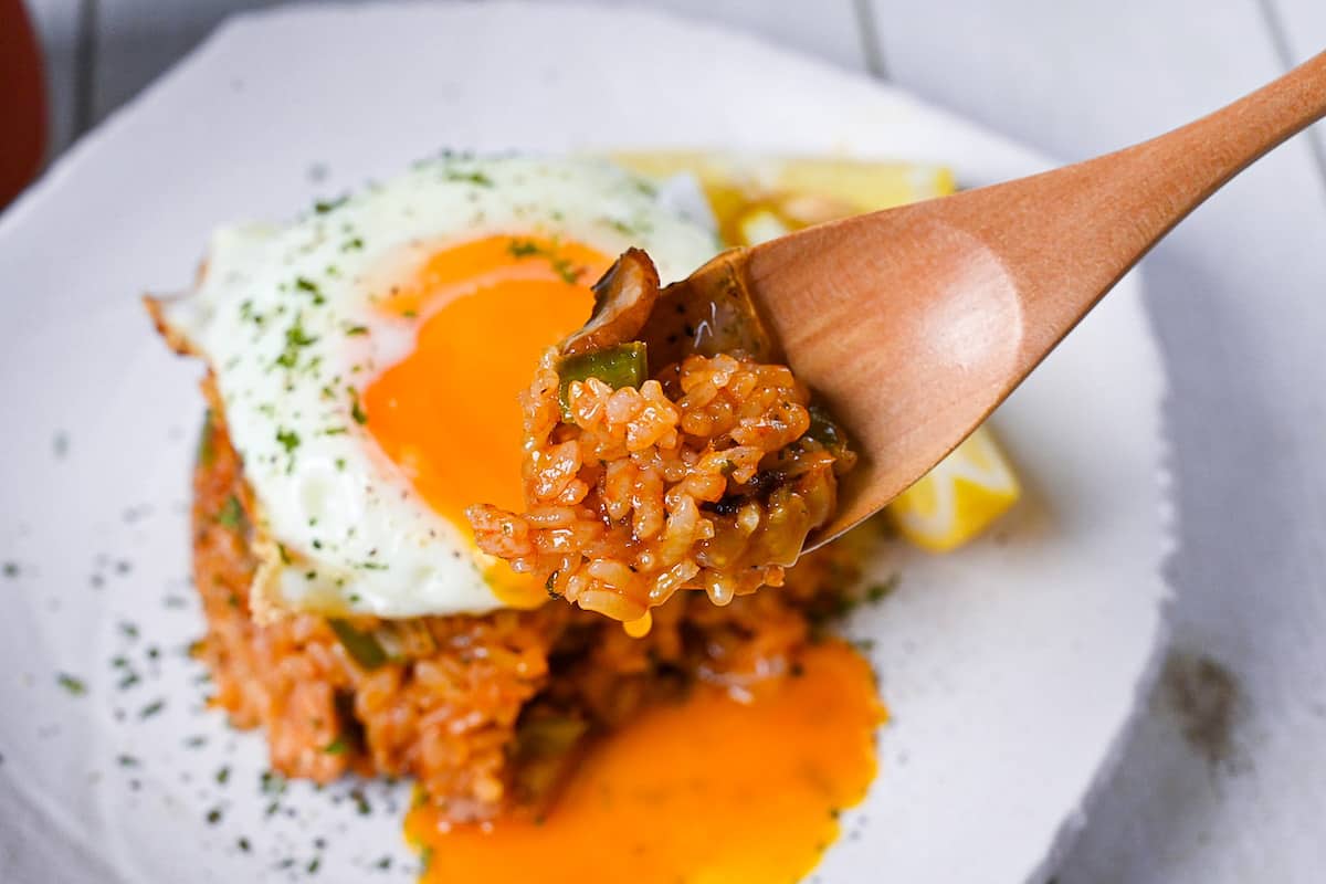 Japanese ketchup rice (chicken rice) on a wooden spoon