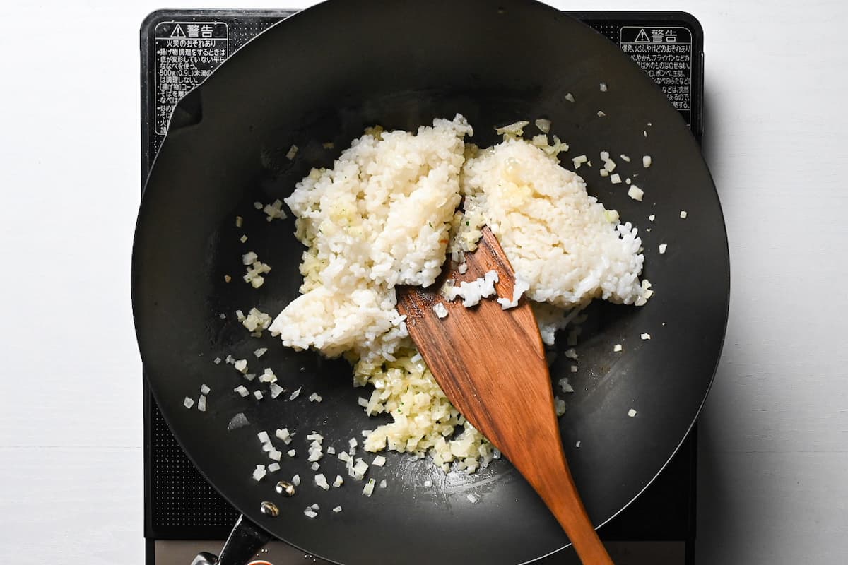 frying rice in a wok