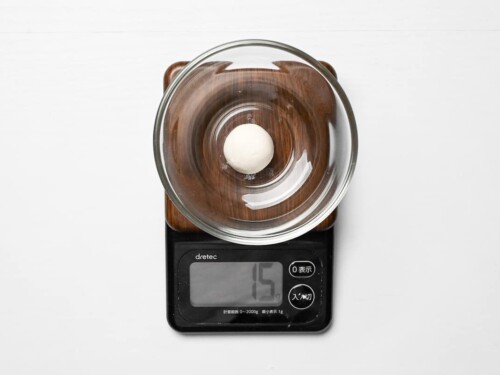 one dango in a small glass bowl measured on a digital scale (15g)