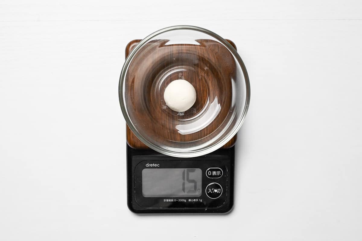 one dango in a small glass bowl measured on a digital scale (15g)