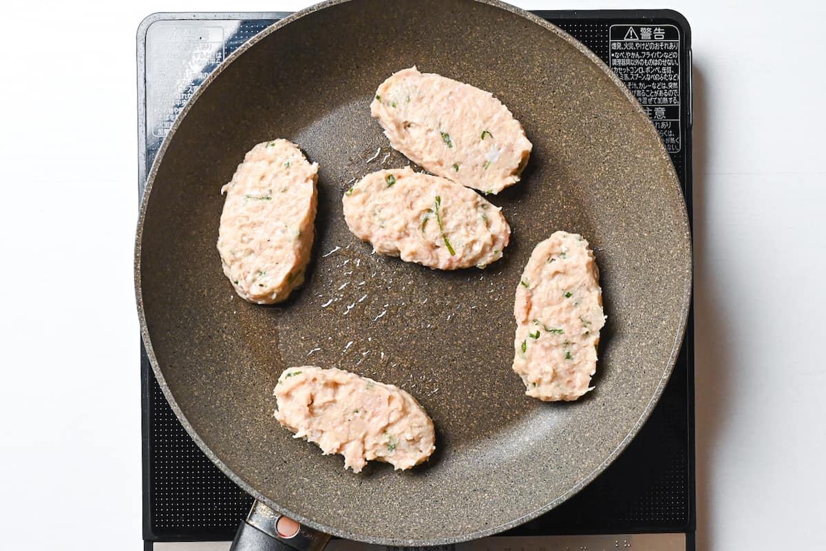 chicken tsukune in a frying pan