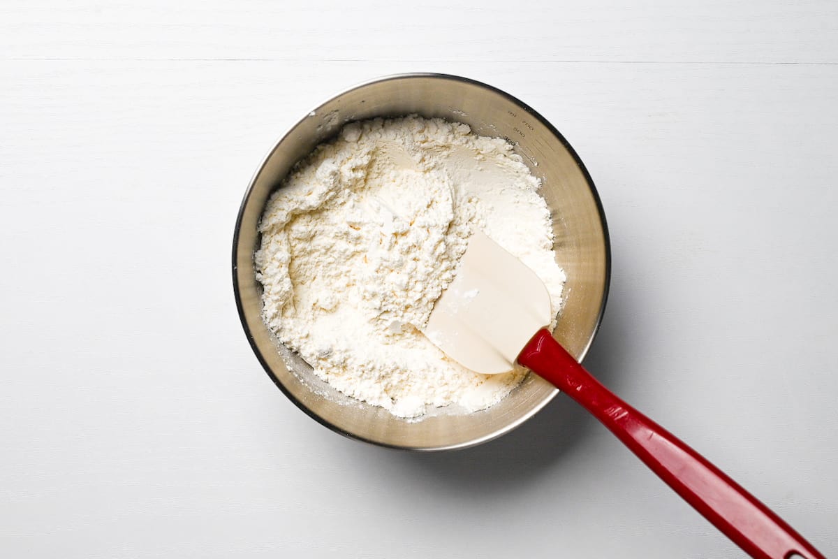 Cake flour and baking powder mixed in a bowl