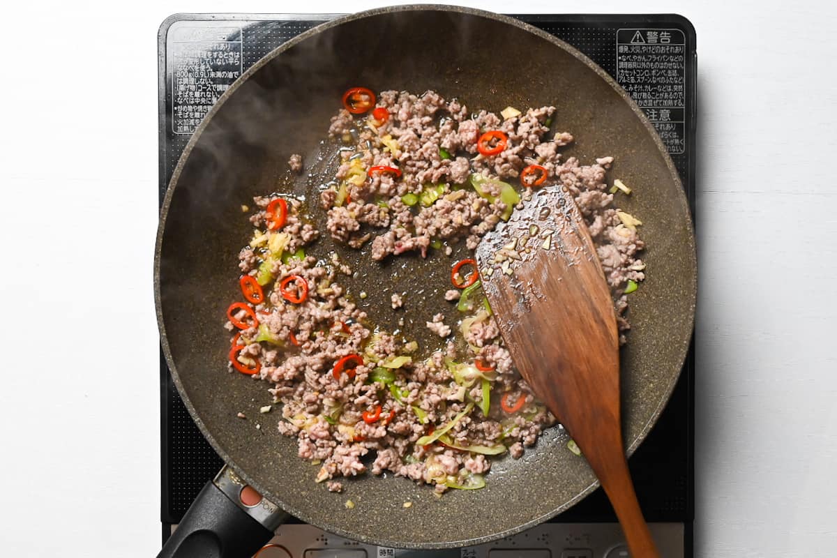 Frying ground pork in a frying pan