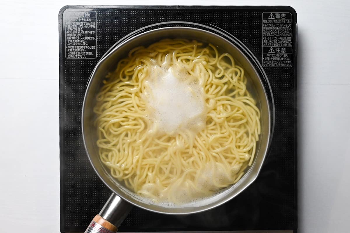 boiling ramen noodles in a pot