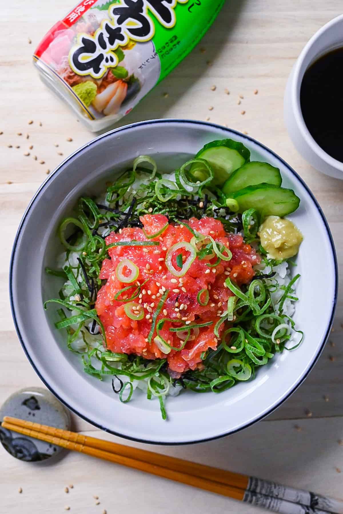 Negitorodon made with tuna and salmon in a white and blue bowl