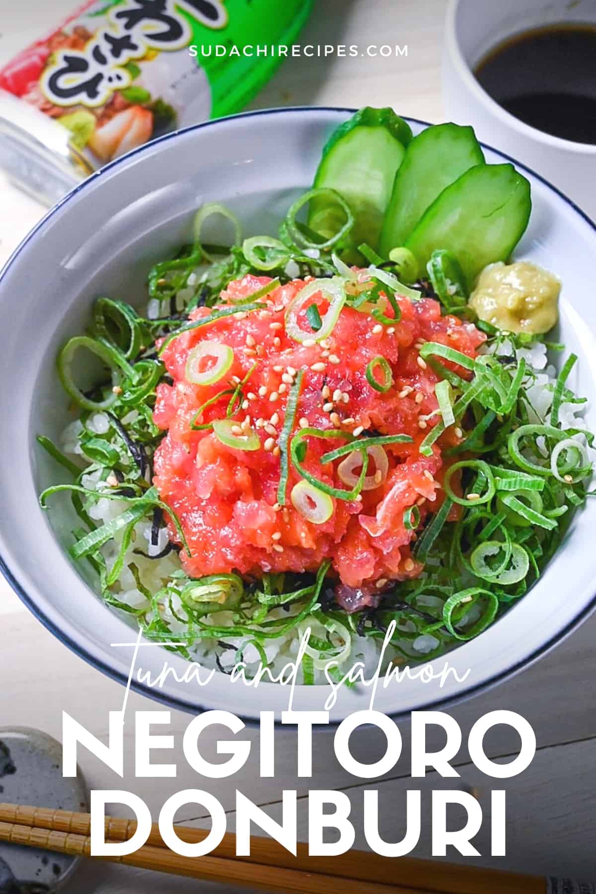 Negitorodon made with tuna and salmon in a white and blue bowl with cucumber and wasabi on the side
