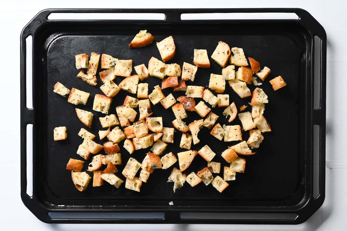 Homemade croutons on a baking sheet