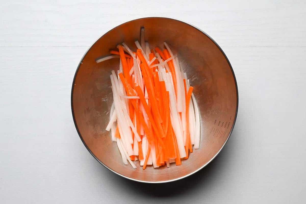 carrot and daikon salted in a bowl