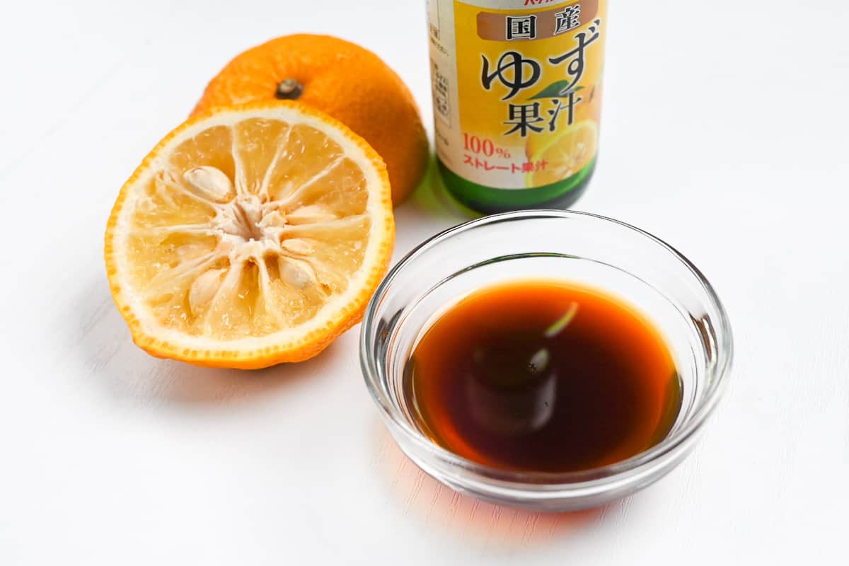 yuzu ponzu sauce with real yuzu fruit and bottle of yuzu juice