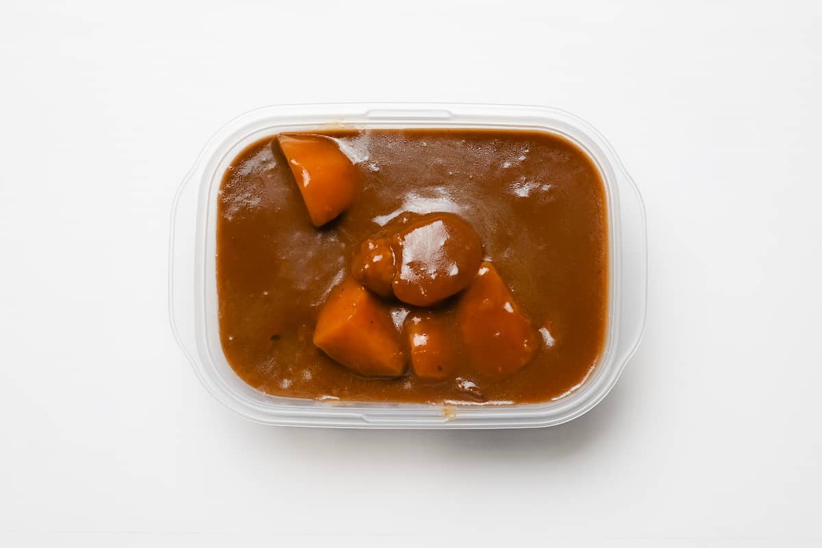 Japanese curry in a storage container ready for refrigeration