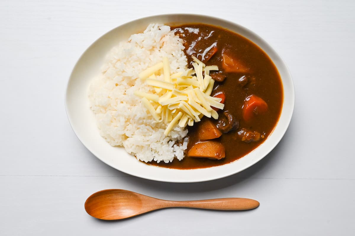 Japanese curry topped with shredded cheese