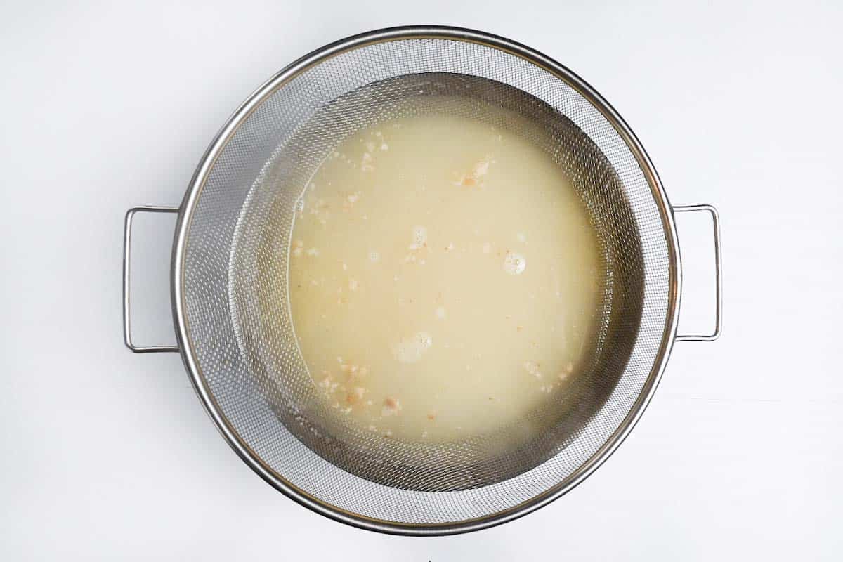 Straining the chicken broth