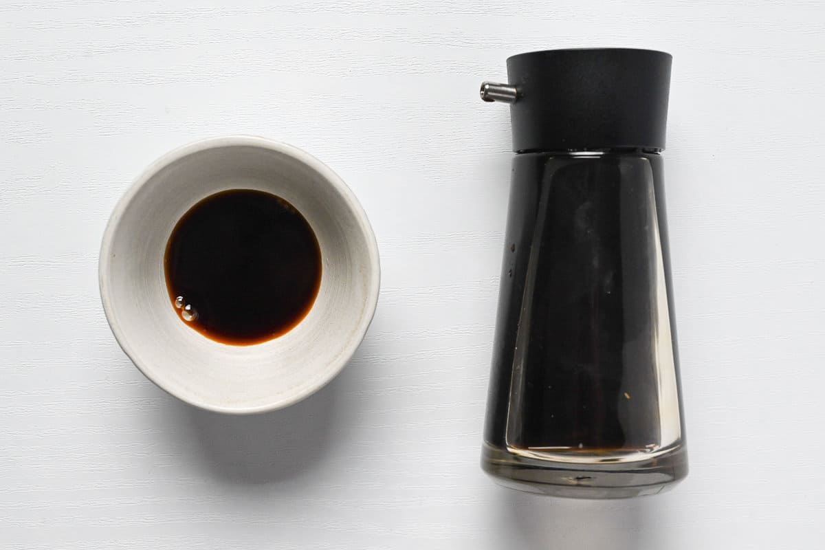 Japanese soy sauce in a ceramic bowl and glass bottle